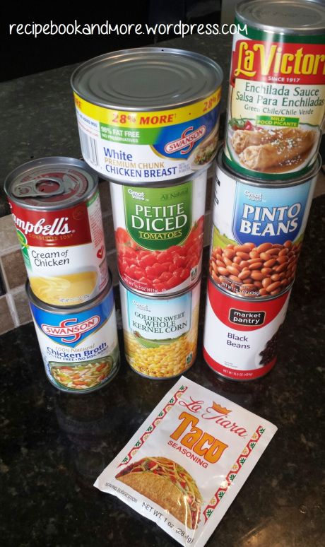 several cans of food are sitting on a counter top next to a packet of chips