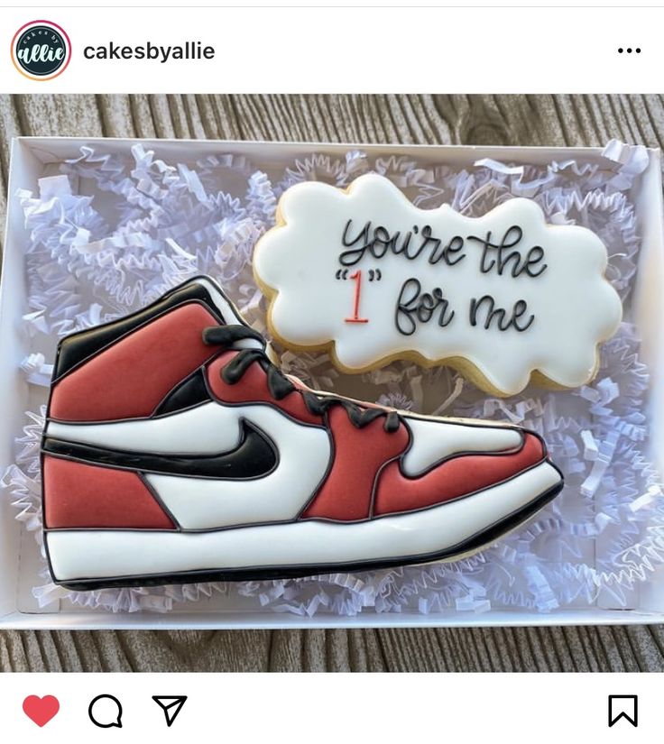 a cookie decorated like a shoe with the words you're the 1 for me