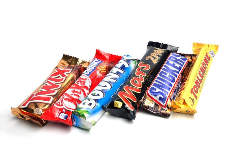 four different types of candy bars on white background stock photo - image 349784