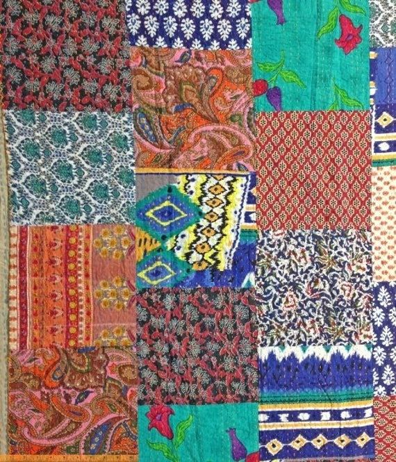 an old patchwork quilt with many different colors and patterns