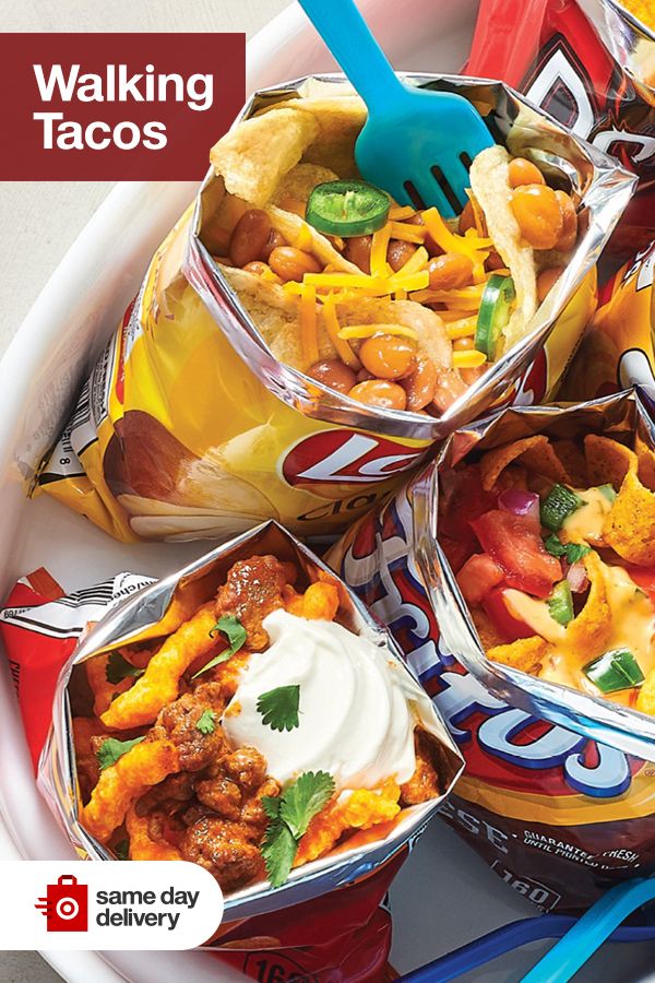 a bowl filled with lots of tacos and chips