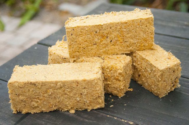 several pieces of cornbread sitting on top of a wooden table