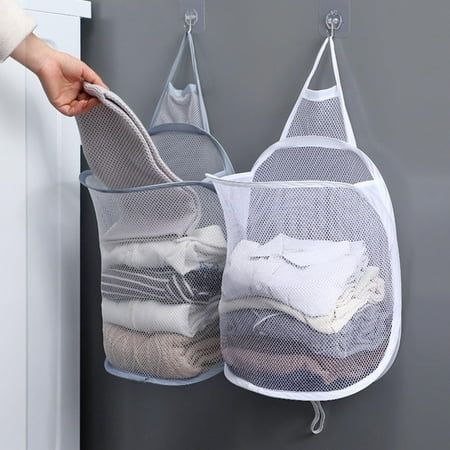 two mesh storage bags hanging on the wall