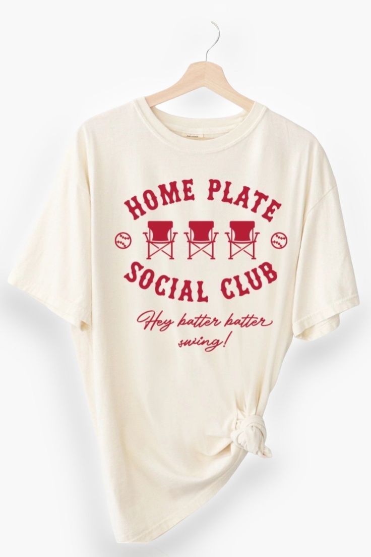 Step up to the plate in style with the Home Plate Social Club Tee! This trendy graphic tee, in a chic sand color complemented by a bold red graphic, is perfect for cheering on your favorite team. Whether you're a dedicated baseball mom or just love the game, this baseball t-shirt brings the perfect blend of comfort and flair to your wardrobe. With its soft fabric and stylish design, you'll be game-day ready and beyond stylish for any casual outing. Embrace your love for the game and make a fashi Hey Batter Batter, Mom Wardrobe, Home Plate, Trendy Graphic Tees, Color Complement, Mom Tees, Baseball Mom, Sand Color, Social Club