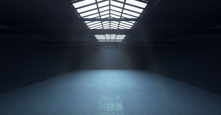 an empty room with a skylight in the middle and white tiles on the floor