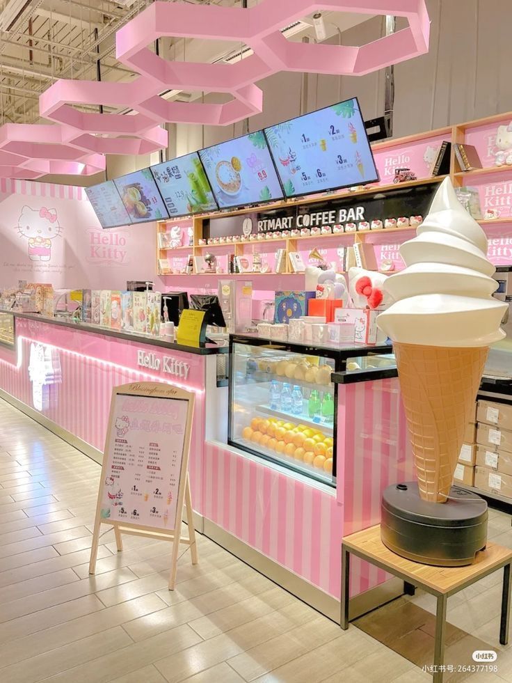 an ice cream shop with pink and white decor