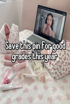 a laptop computer sitting on top of a table next to some lipstick and other items