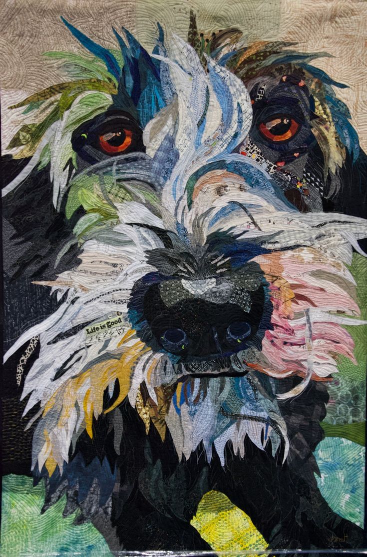 a close up of a painting of a dog's face with feathers on it