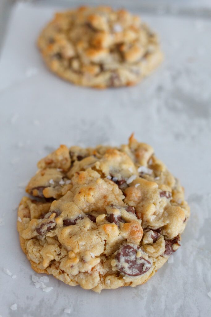 two cookies sitting on top of a baking sheet