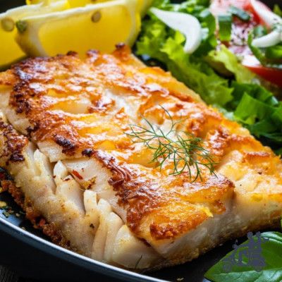 a close up of a plate of food with meat and vegetables on the side,