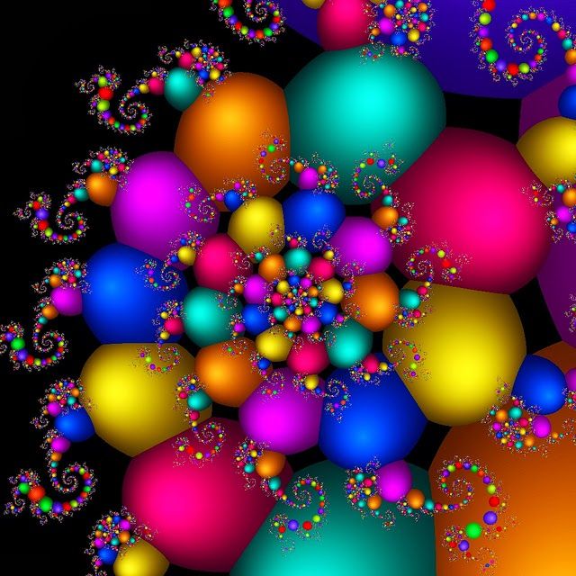 an abstract image of colorful balls and swirls