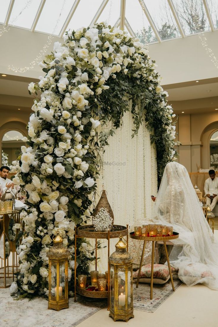 a wedding ceremony setup with flowers and candles