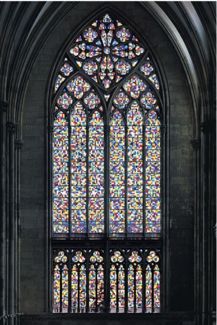 a large stained glass window in the middle of a building