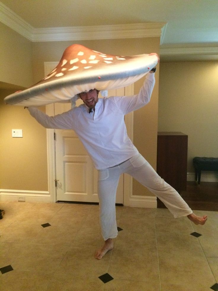 a man in white is balancing on his head