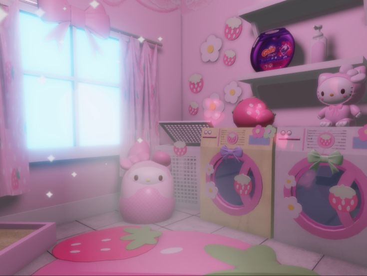 a room with hello kitty decorations and pink walls