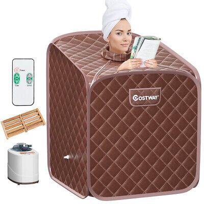 an image of a woman with a towel on her head sitting in a portable heater