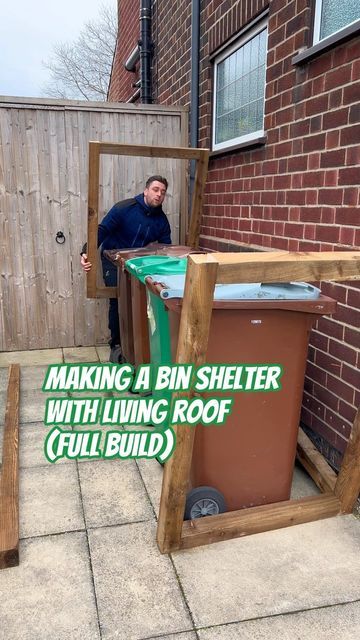 a man standing next to a trash can with the words making a bin shelter with living roof full build