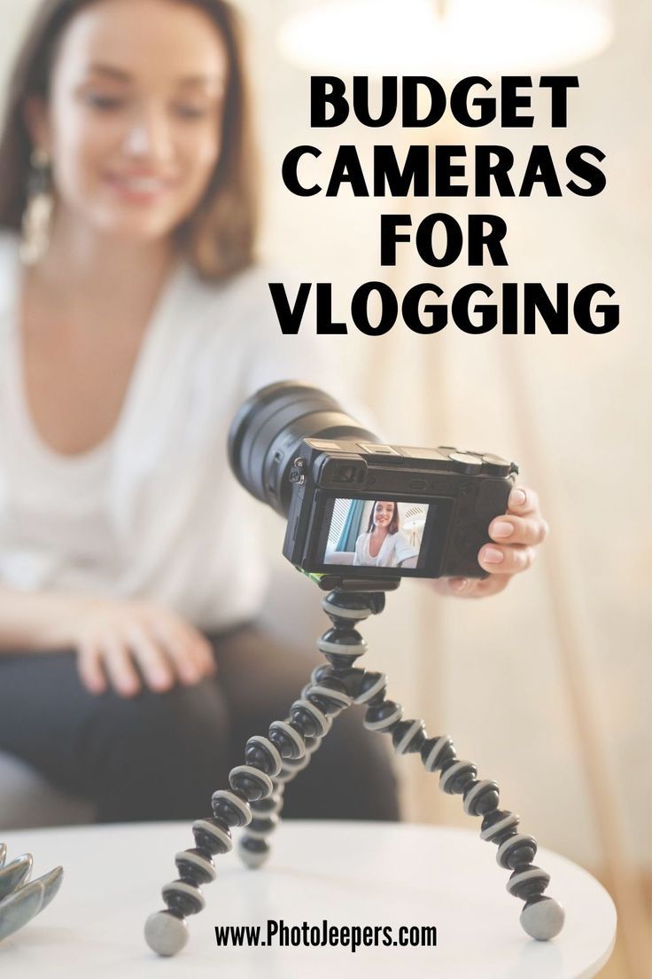 a woman sitting on a couch with a camera in front of her and the words budget cameras for vlogging