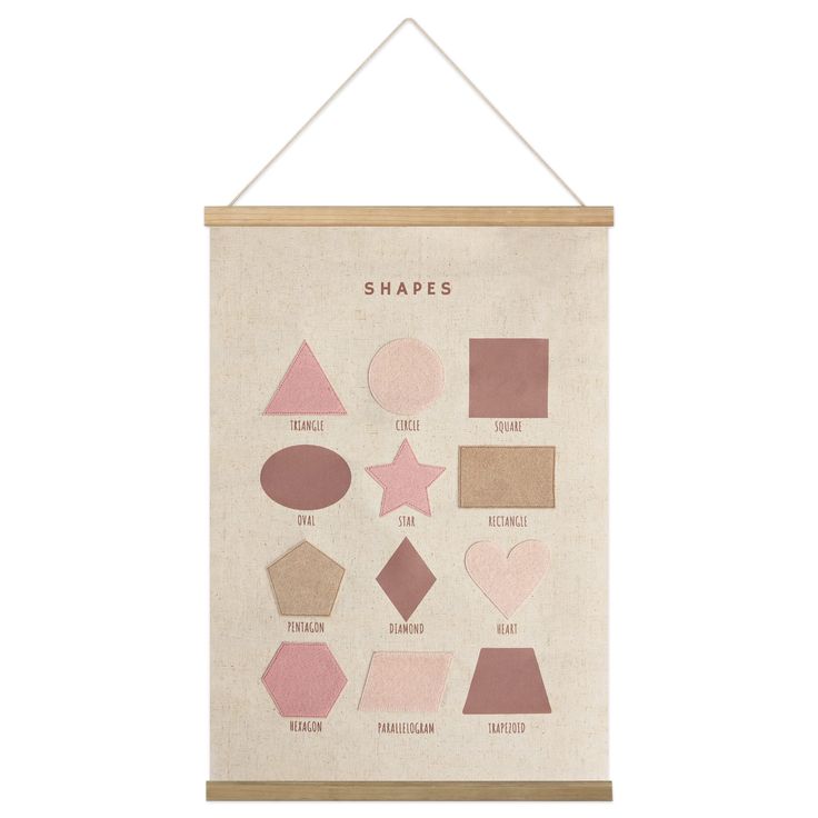 a poster hanging on the wall with shapes in pink, brown and beige colors that say shapes