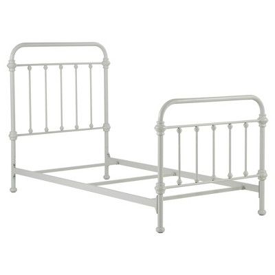 a white metal bed frame with no headboard