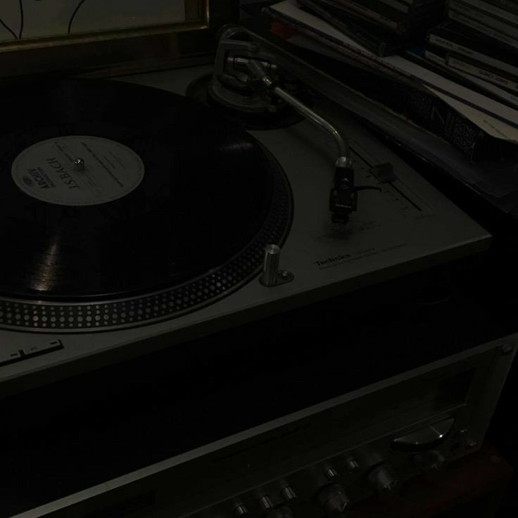 a turntable sitting on top of a record player