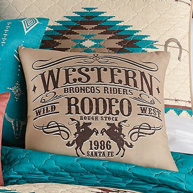 the western rodeo pillow is on top of a bed with blue comforter and pillows