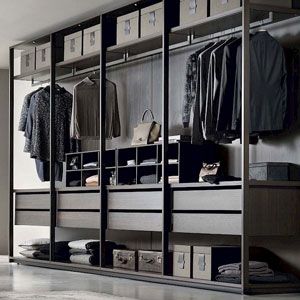 an organized closet with clothes and shoes