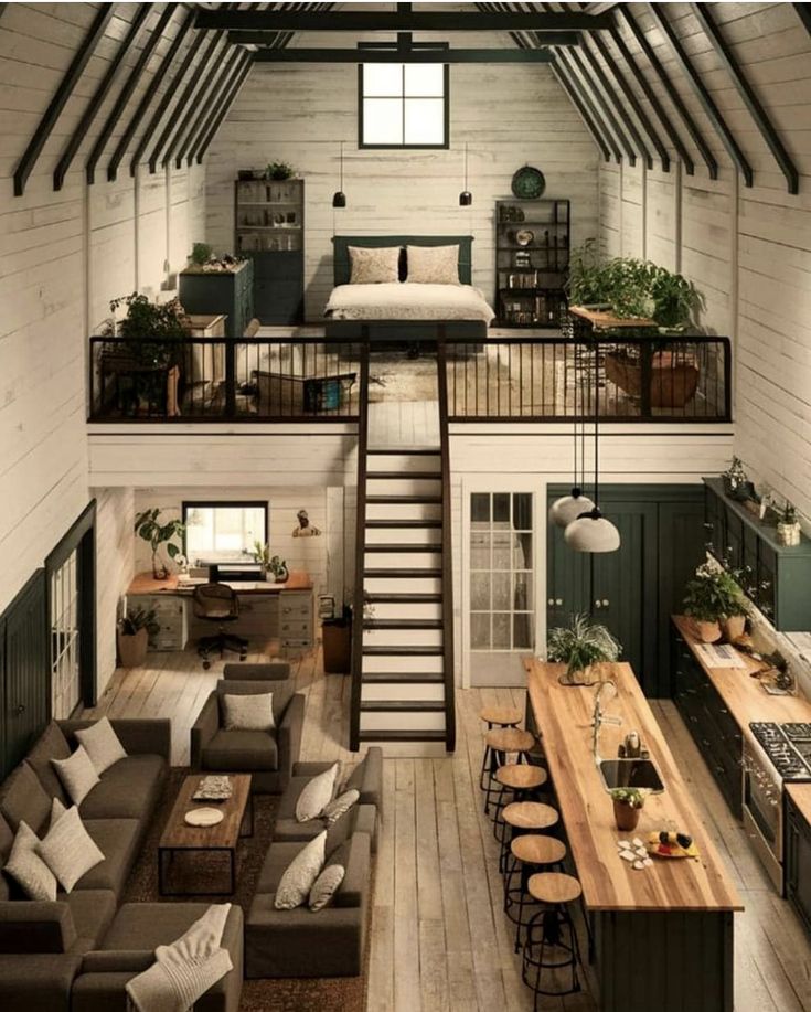 an open loft with stairs leading to the upper floor