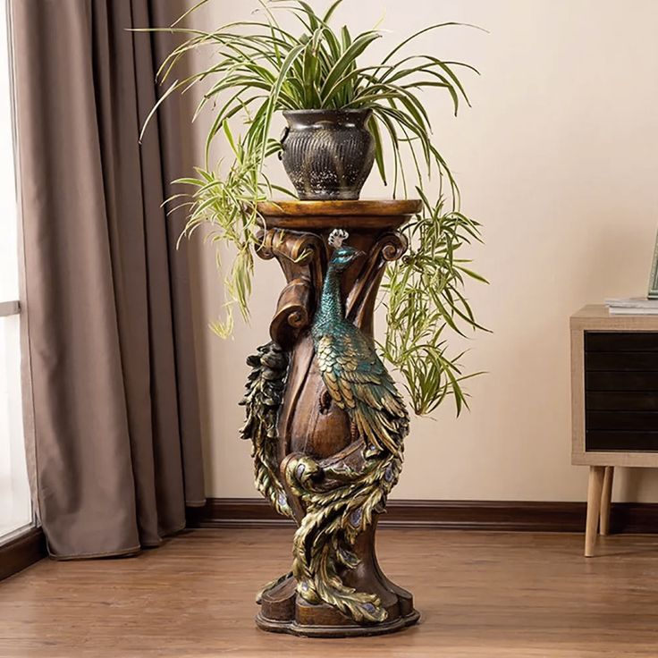 a potted plant sitting on top of a wooden stand