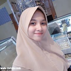 a woman wearing a hijab in a jewelry store