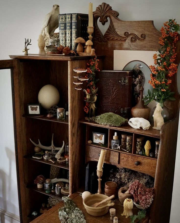 an old bookcase with many items on it