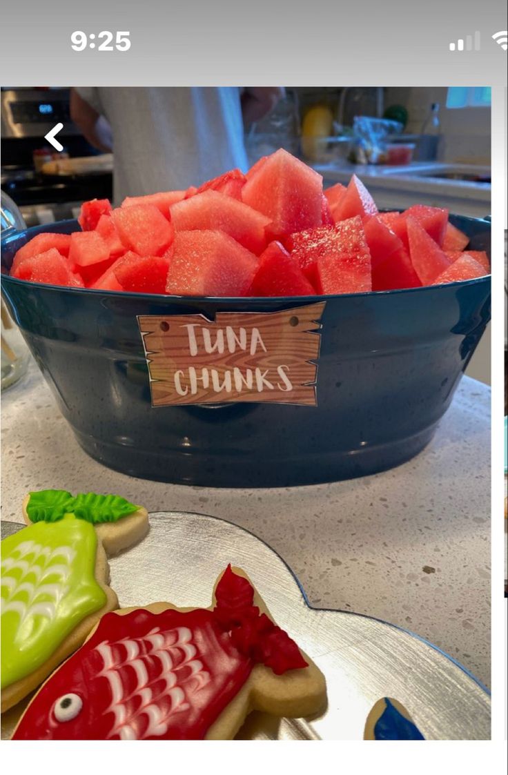 a bowl filled with cut up watermelon next to another bowl full of cut up watermelon