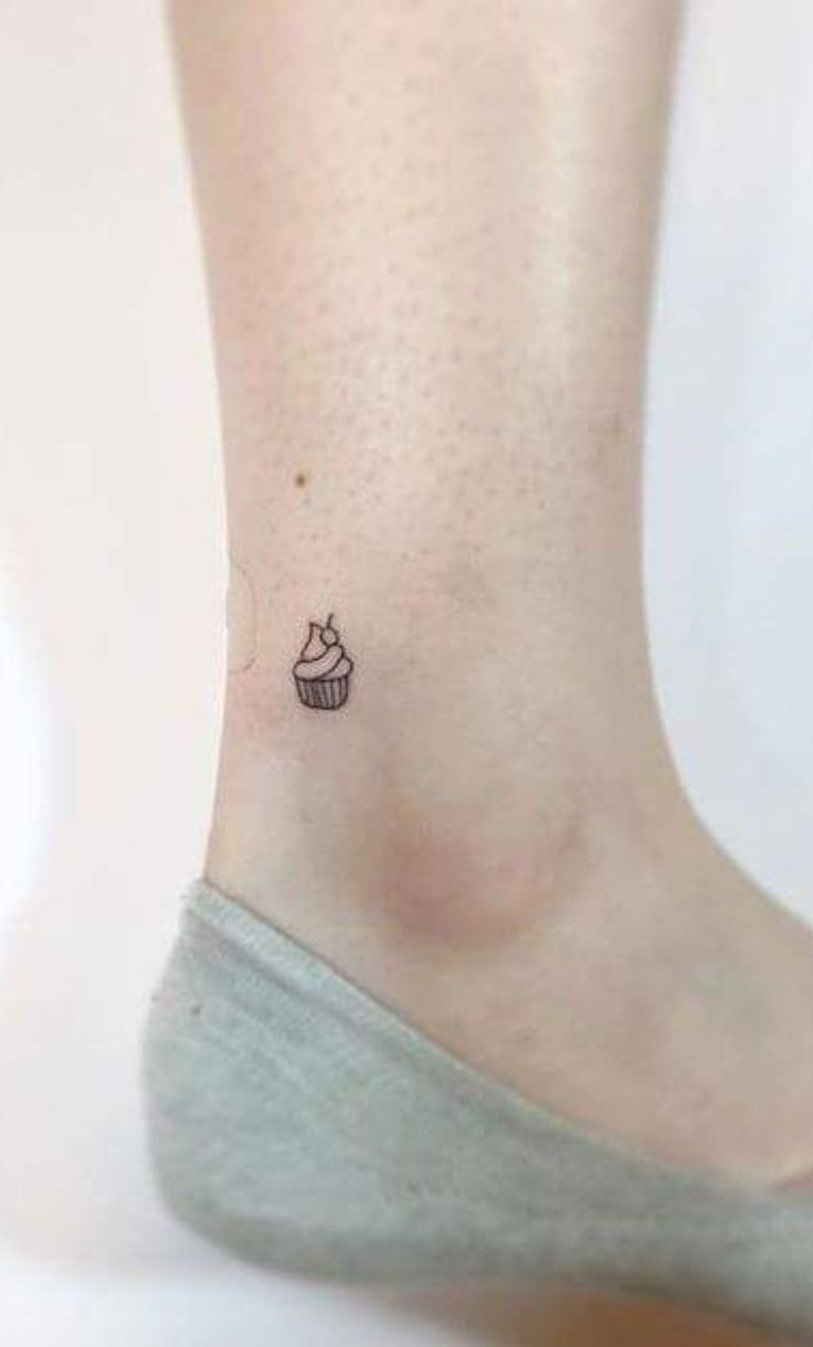 a small cupcake tattoo on the ankle