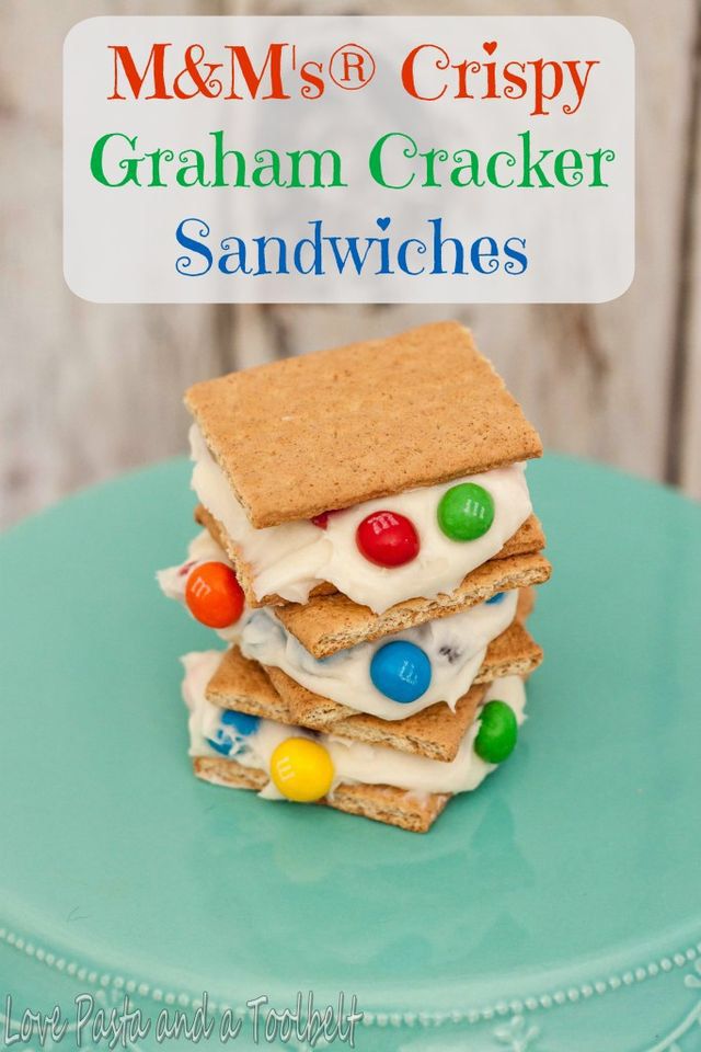 graham cracker sandwiches are stacked on top of each other with m & ms candy