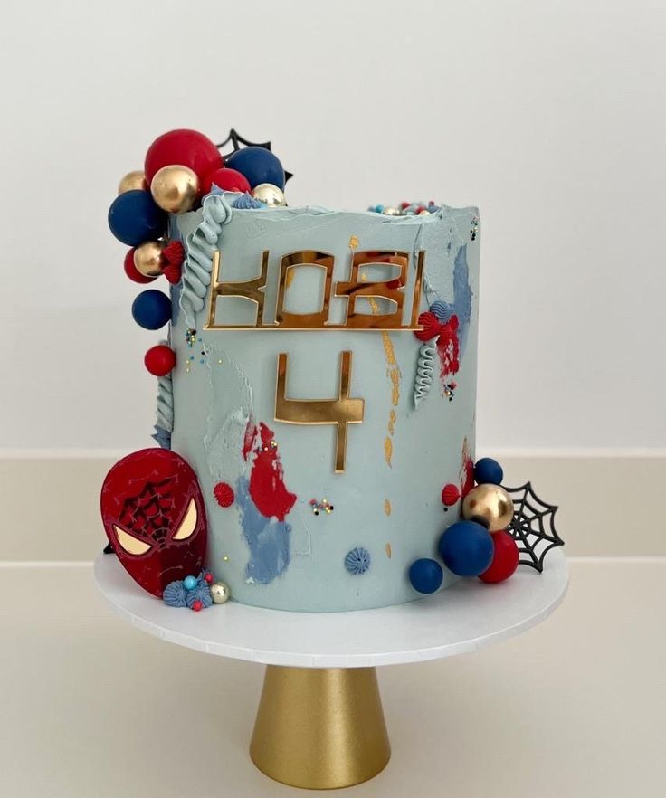 a blue birthday cake with red, white and blue decorations on it's side