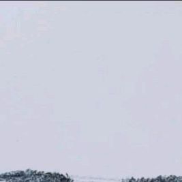 an airplane flying in the sky on a clear day