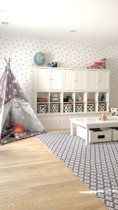 a child's room with a teepee tent on the floor