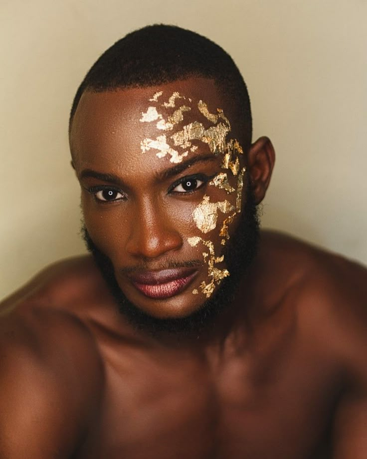 Gold Makeup Looks Men, Editorial Gold Makeup, Glitter Fashion Editorial, Gold Leaf Makeup Looks, Men Glitter Makeup, Greek Inspired Makeup, Greek God Makeup Men, Male Fairy Makeup, Hadestown Makeup