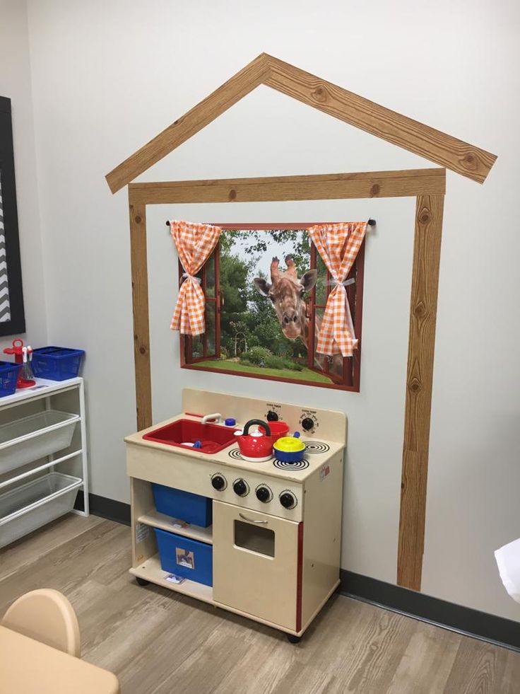 a child's play room with an old fashioned stove