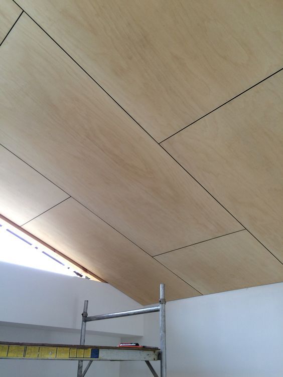 an unfinished ceiling in a room with scaffolding