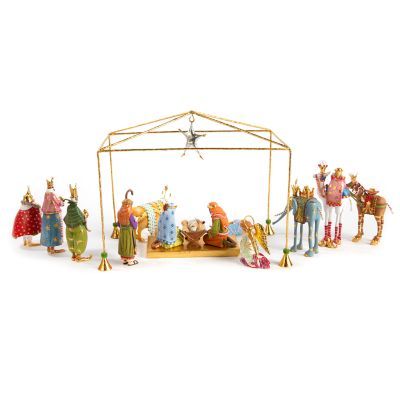 a nativity scene with figurines in the form of people and animals on a white background