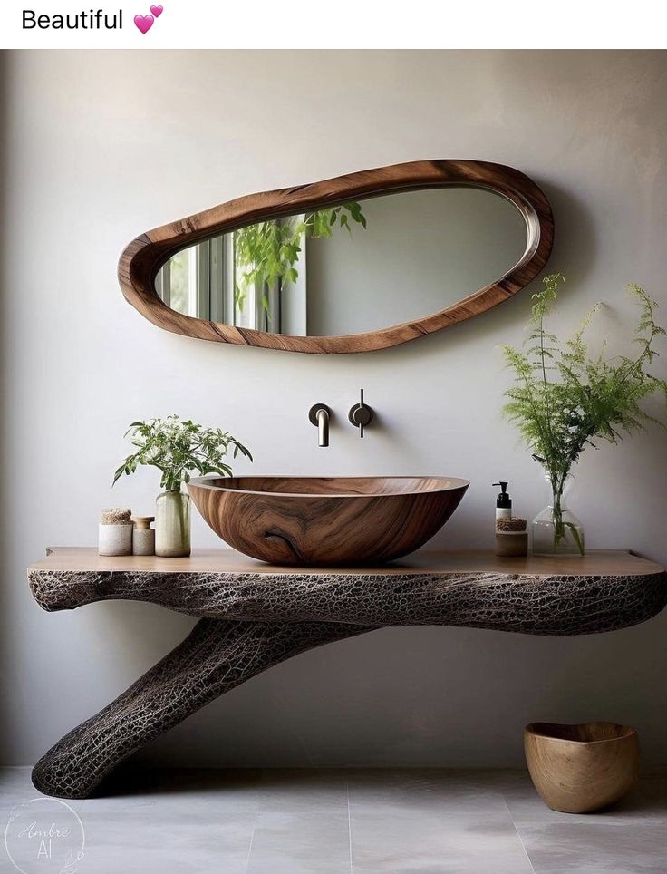 a bathroom sink sitting under a mirror next to a wooden table with plants on it