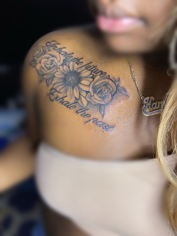 a woman with a sunflower tattoo on her shoulder