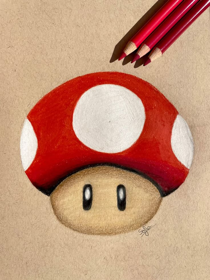 a drawing of a mushroom with two pencils next to it