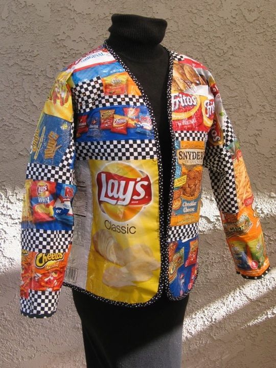 a mannequin wearing a jacket made out of food and candy bars on it