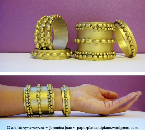 two different views of gold bracelets with beads on the sides and one in the middle