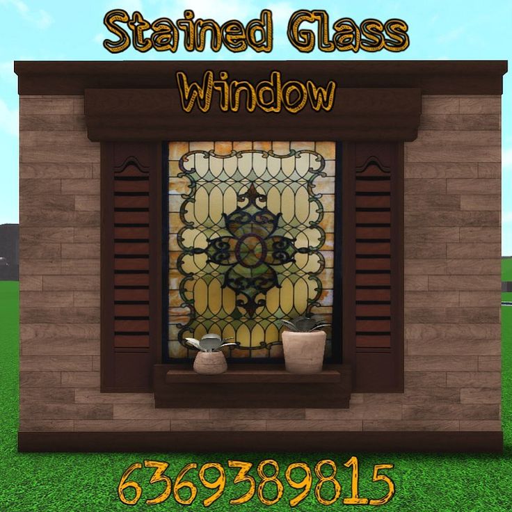 the stained glass window is in front of a brick wall