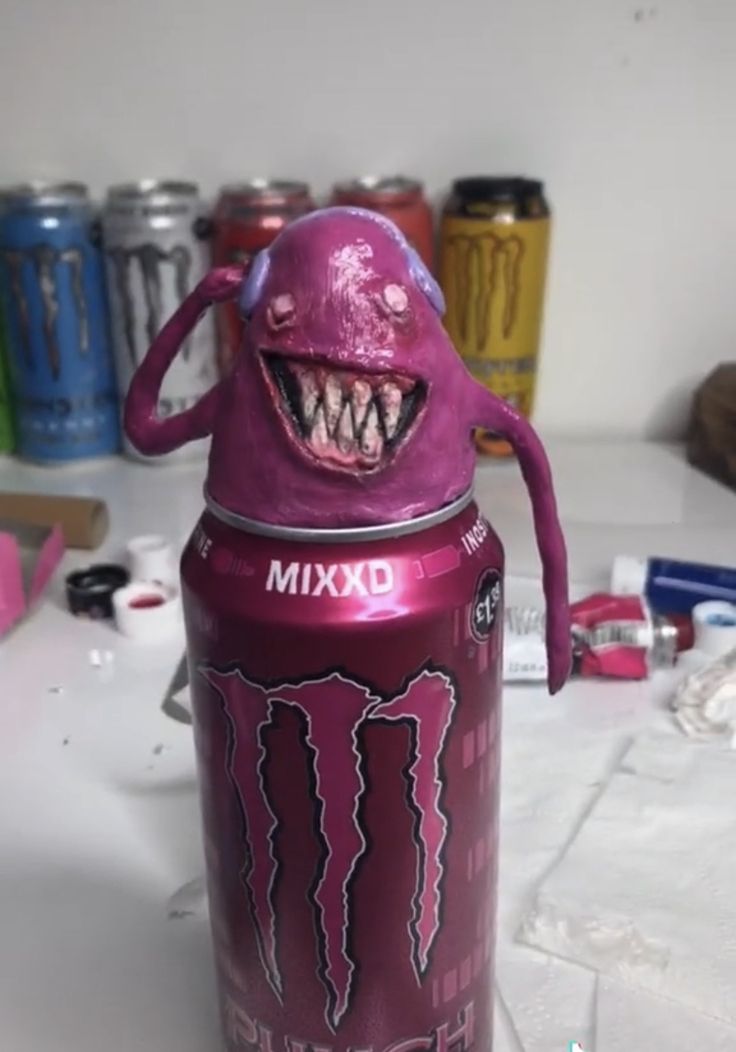 a purple monster can sitting on top of a table