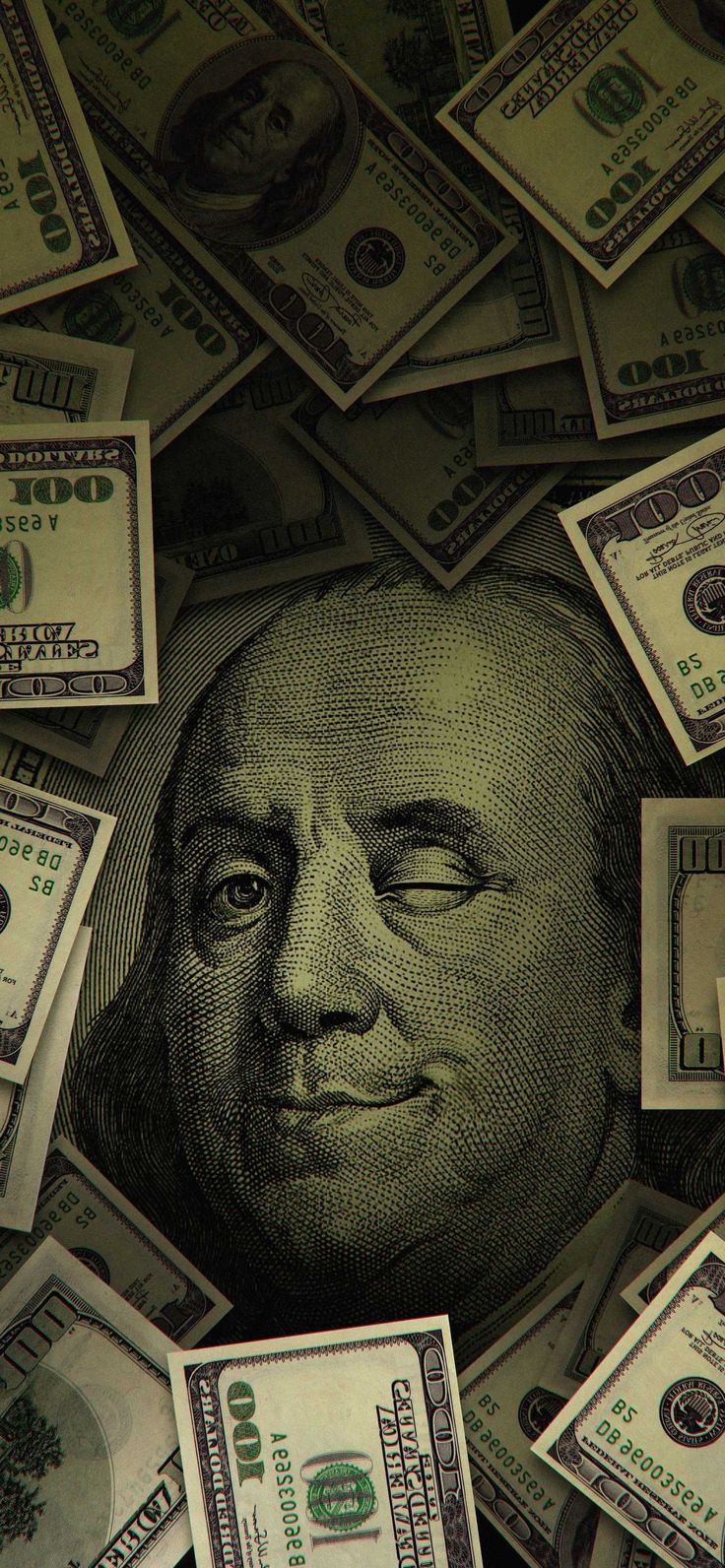 a large pile of money with a man's face in the middle