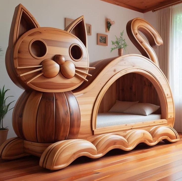 a cat bed made out of wood on top of a wooden floor